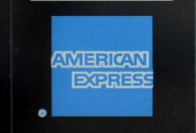 Amex profits fall as higher spending offset by loan losses